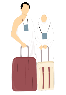 Two pilgrims, a man and a woman, dressed in white Ihram clothing, standing with their luggage.
